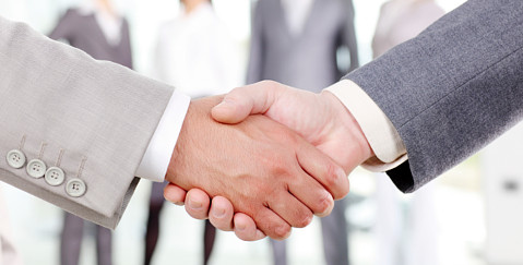 Settlement Agreement Solicitors - Business people shaking hands